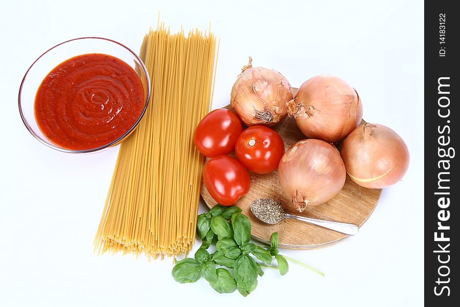 Ingredients for spaghetti bolognese or napoli on white background. Ingredients for spaghetti bolognese or napoli on white background