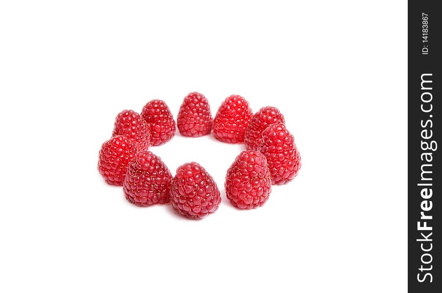 Ripe,juicy raspberries isolated on a white background. Ripe,juicy raspberries isolated on a white background.