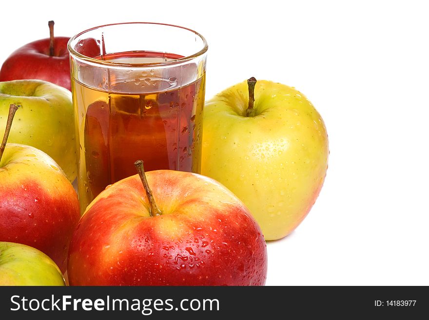 Several fruits and glass full of juice