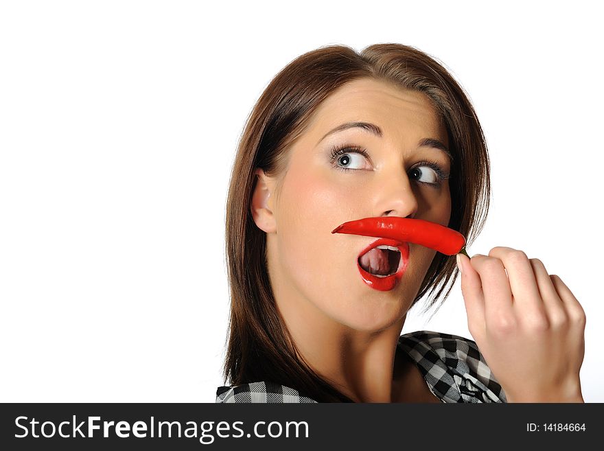 Beautiful sexy woman with red hot chilli pepper. isolated on white background