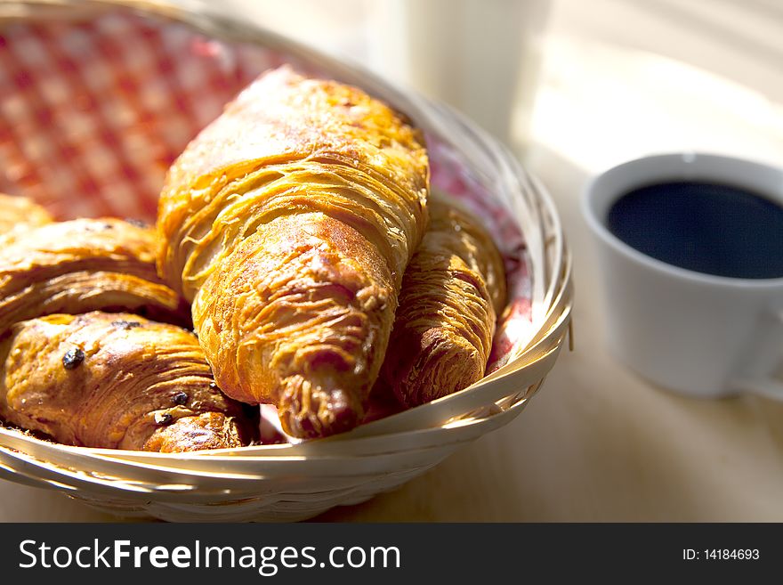 Close up with croissants on a wooden basket