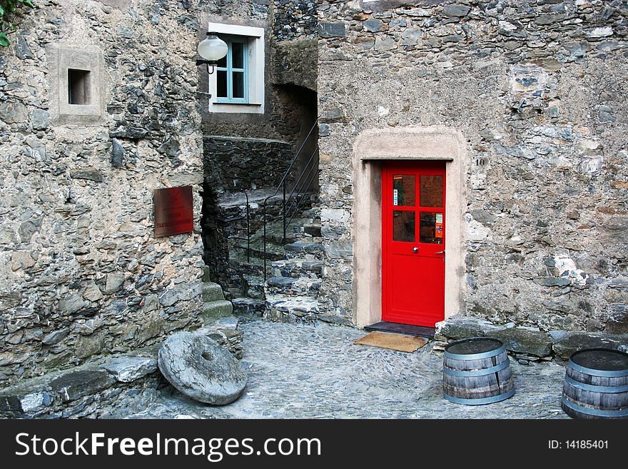 Small stone village with coloured doors, Italy