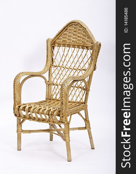 This image shows a high chair made of wicker. This image shows a high chair made of wicker