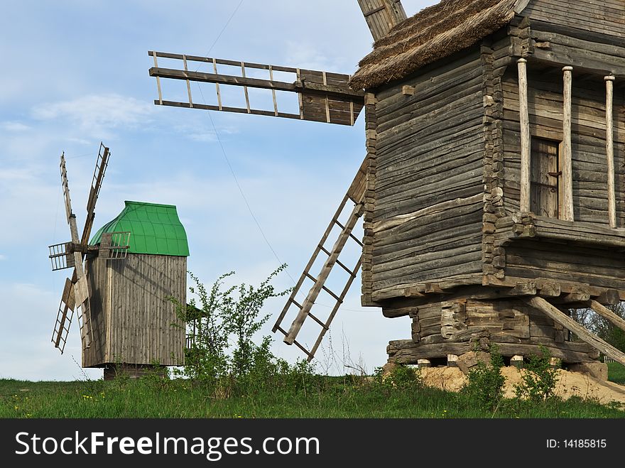 Old windmills stand alone in the field
