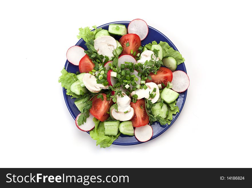 Tasty salad of vegetables on a white background. Tasty salad of vegetables on a white background