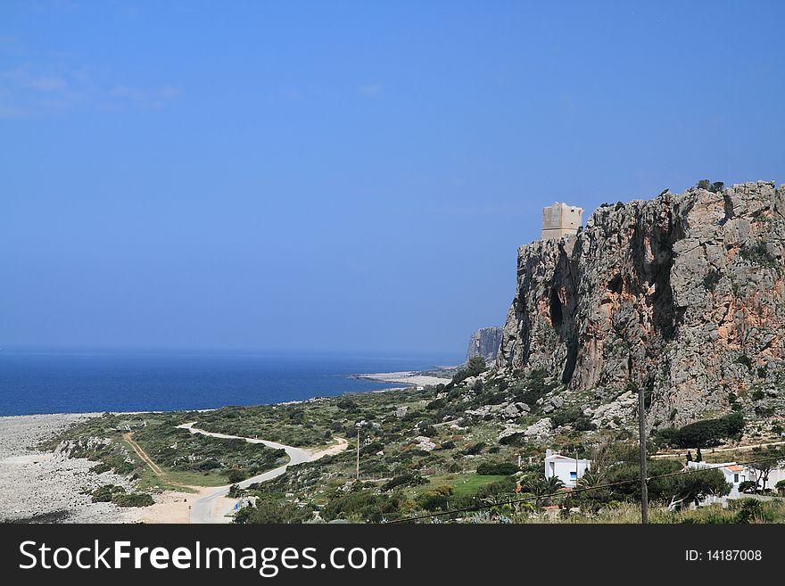 A glimpse of the Sicilian landscape rock overlooking the sea green. A glimpse of the Sicilian landscape rock overlooking the sea green