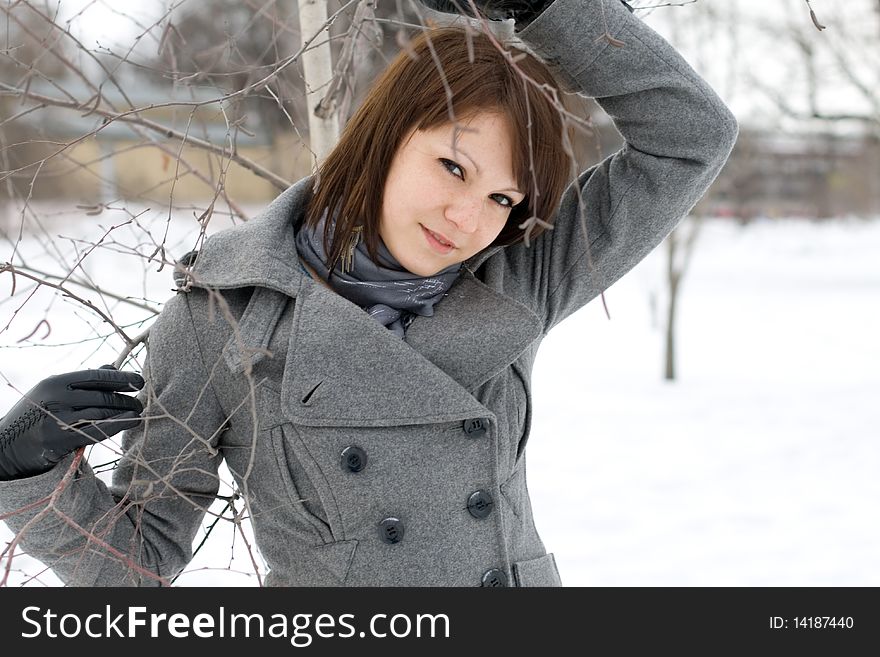 Closeup portrait of a girl walking in winter park