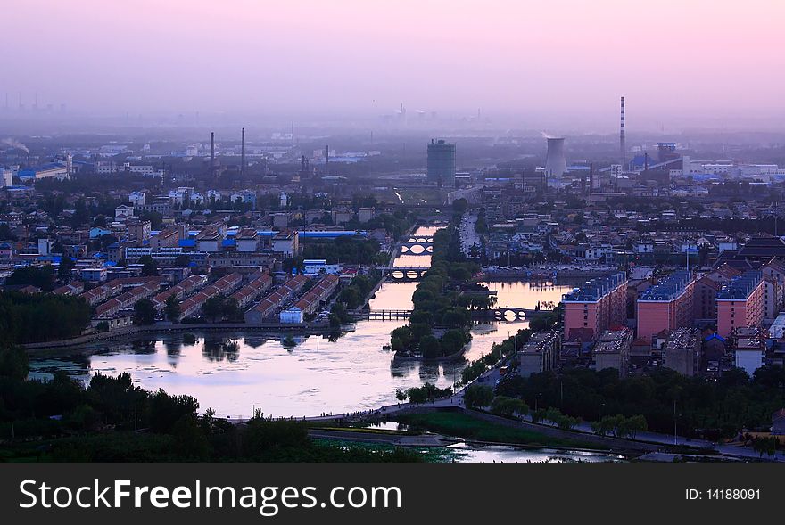 Sunset from a hill overlooking a city. Sunset from a hill overlooking a city.