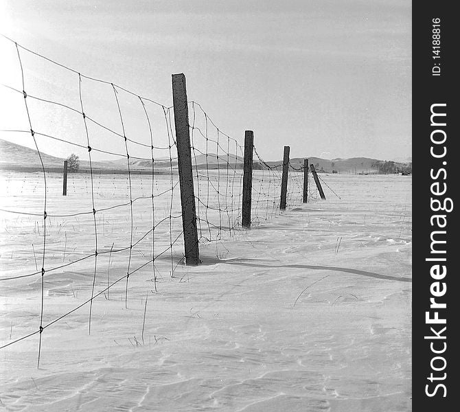 A broken fence in the snow,shooting in bashang of Hebei CHINA.