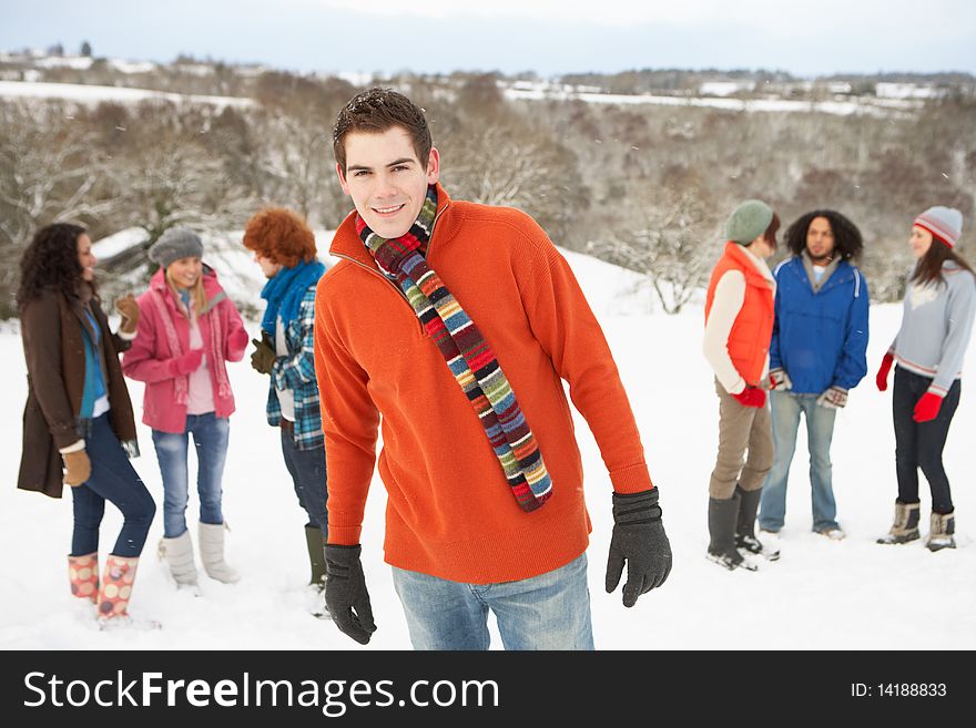 Young Friends Having Fun In Snowy Landscape