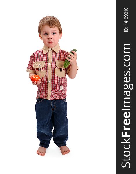 The little boy with vegetables on white background