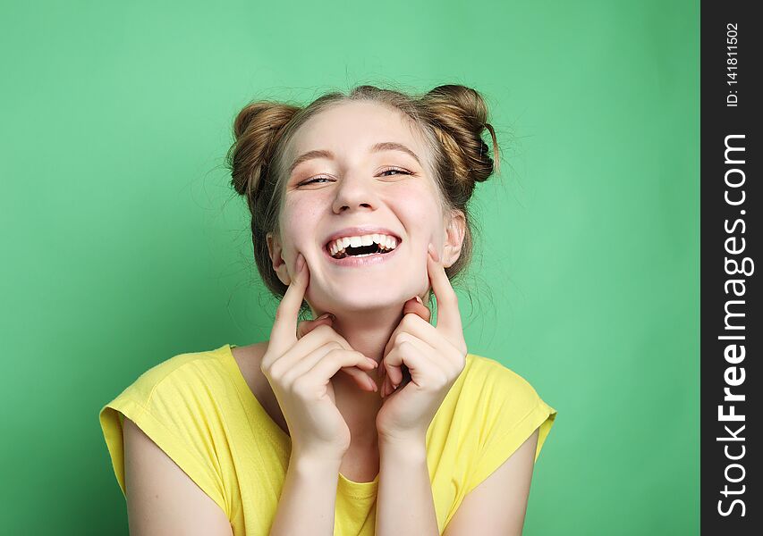 Portrait of beautiful cheerful girl smiling laughing looking at camera