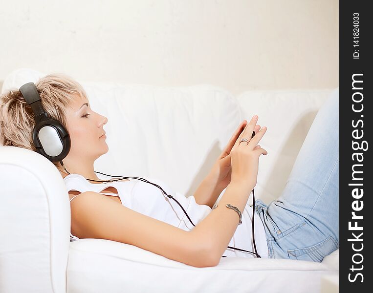 Woman listening to music at home