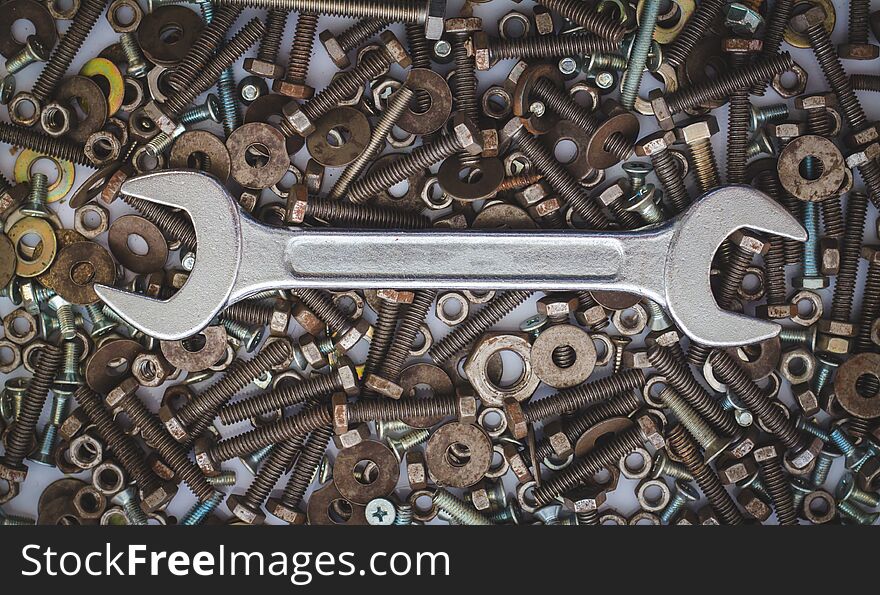 Wrench tool equipment, wrenches on assorted nuts and bolts.