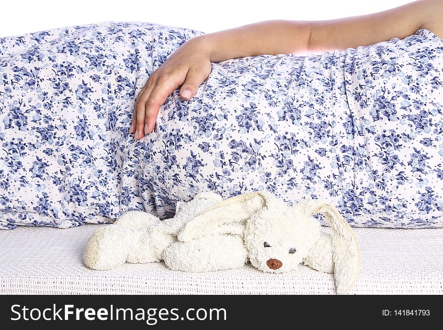 A Happy pregnant girl lies on white background