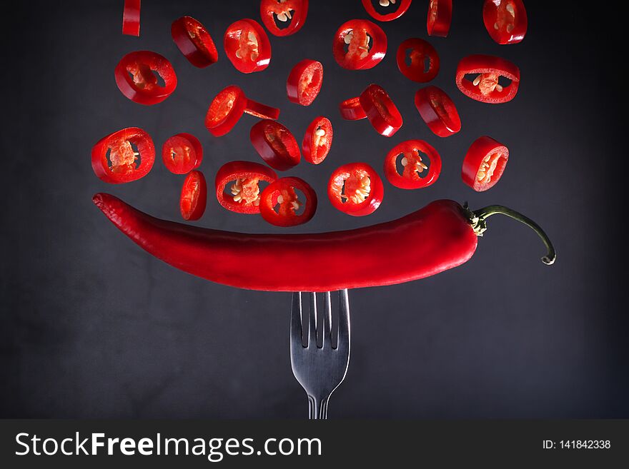 Falling slices of hot chili pepper