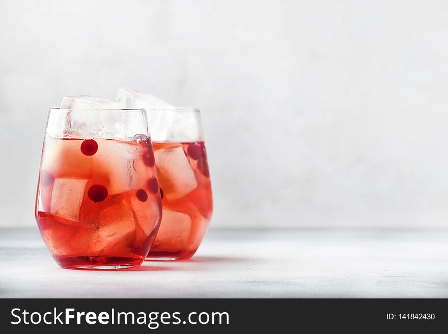 Cranberry Cocktail Cape Kodder With Ice, Rosemary And Berries, Bar Tools, Blue Bar Counter Background, Top View