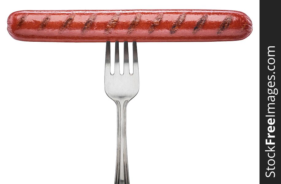 Grilled sausage on a fork. File contains clipping path.