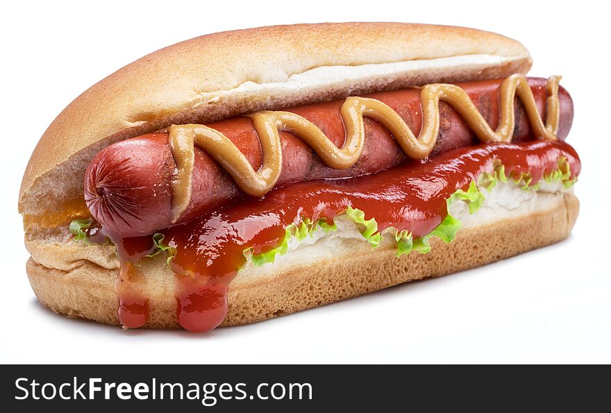 Hot dog - grilled sausage in a bun with sauces isolated on white background.