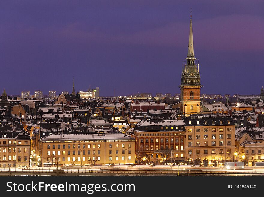 Stockholm Sweden on a winter evening with snow on the rooftops on sunset, Old Town veiw. Stockholm Sweden on a winter evening with snow on the rooftops on sunset, Old Town veiw