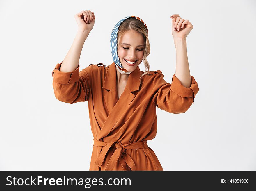 Beautiful young woman wearing silk stylish scarf posing isolated over white wall background dancing