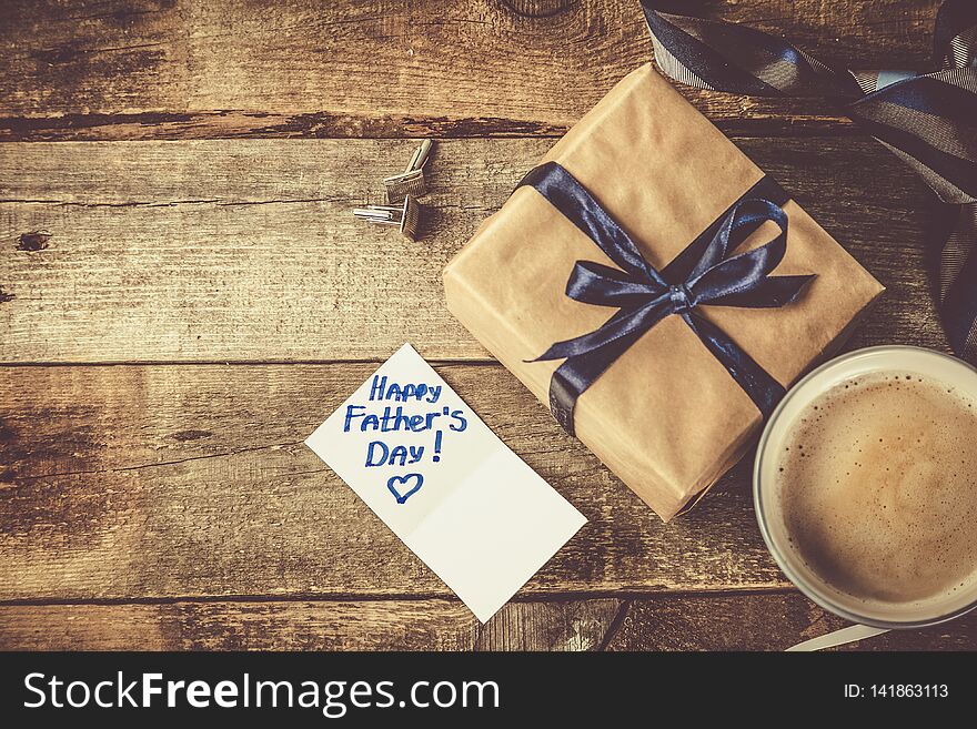 Fathers day concept - present, coffee, tie, mustache