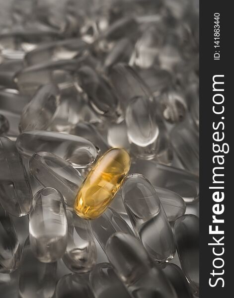 One golden pill not like everyone. Omega 3 capsule background