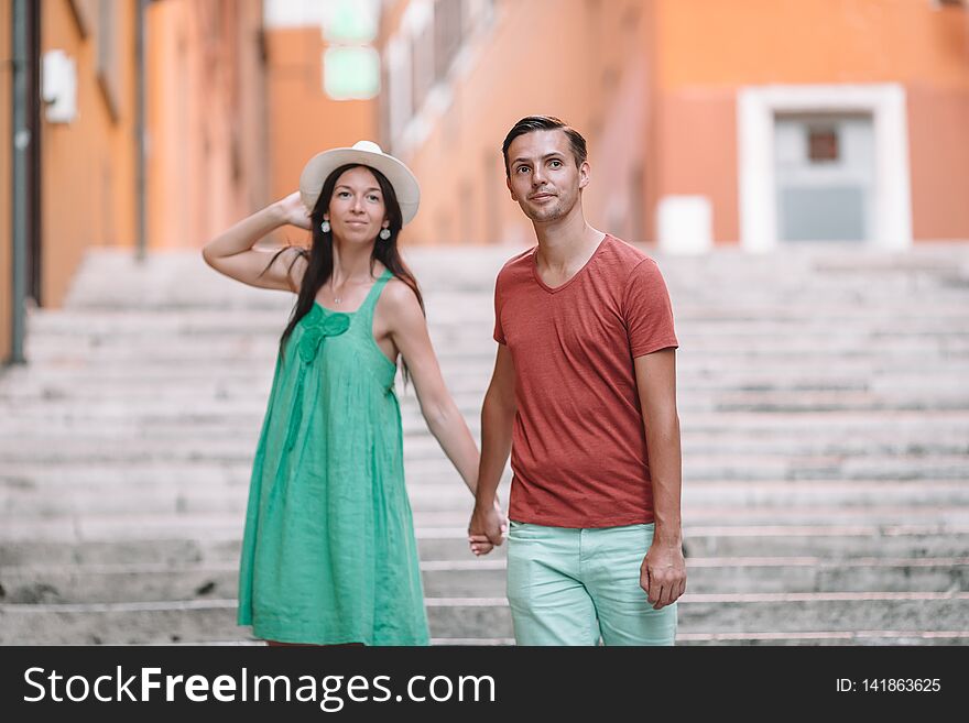 Romantic couple holding hands on Steps in Rome enjoy italian holidays. Happy lovers walking on the travel landmark tourist attraction. Romantic couple holding hands on Steps in Rome enjoy italian holidays. Happy lovers walking on the travel landmark tourist attraction