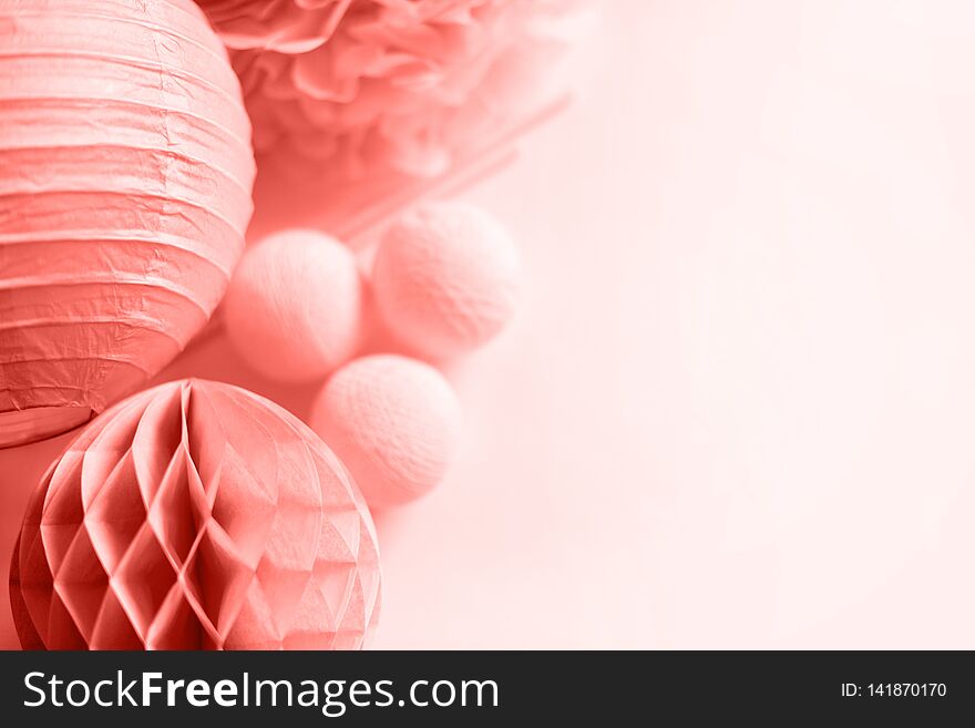 Various festive paper decor in pink color on white background.