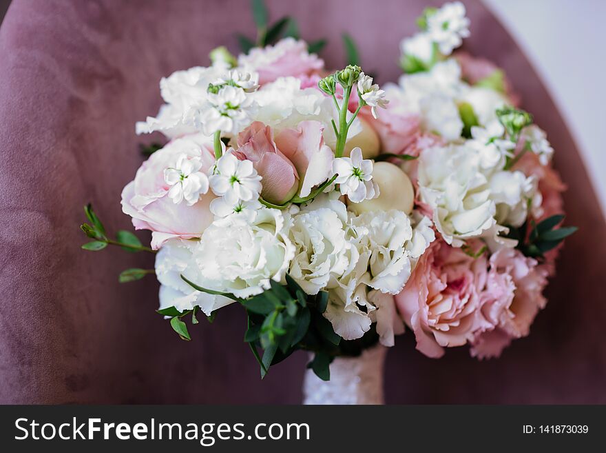 Wedding flowers, bridal bouquet closeup. Decoration made of roses, peonies and decorative plants, close-up, selective focus, nobody, objects