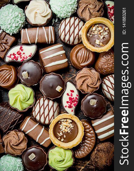 Chocolates candies with different fillings. Top view