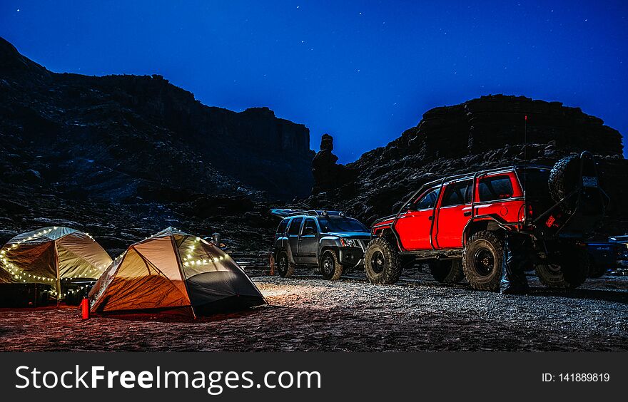 Camping site at night with tents and cars in Utah. Camping site at night with tents and cars in Utah