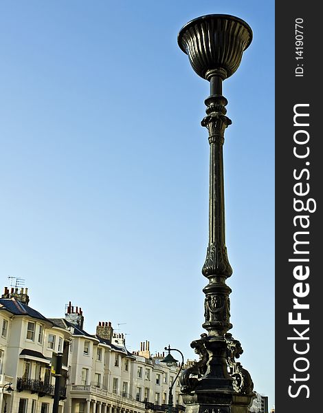 A tall iron urn against a blue sky. A tall iron urn against a blue sky