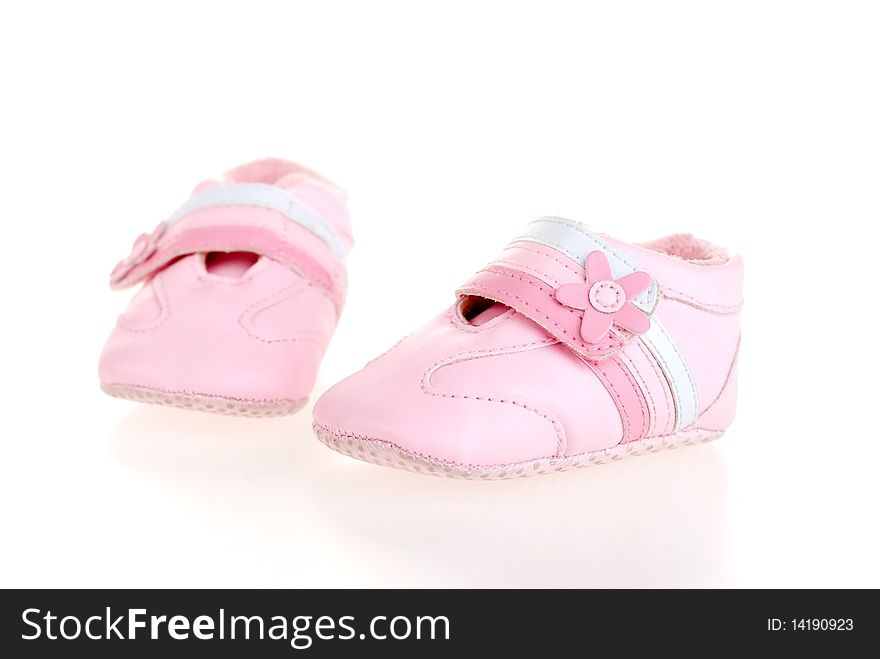 Pink shoes for girls in the studio on a white background. Pink shoes for girls in the studio on a white background.