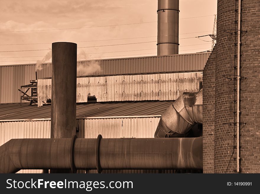 Part of the Heat and Gas Pipes of a modern Furnace to Produce Steel Old Furnace seen from below sepia. Part of the Heat and Gas Pipes of a modern Furnace to Produce Steel Old Furnace seen from below sepia