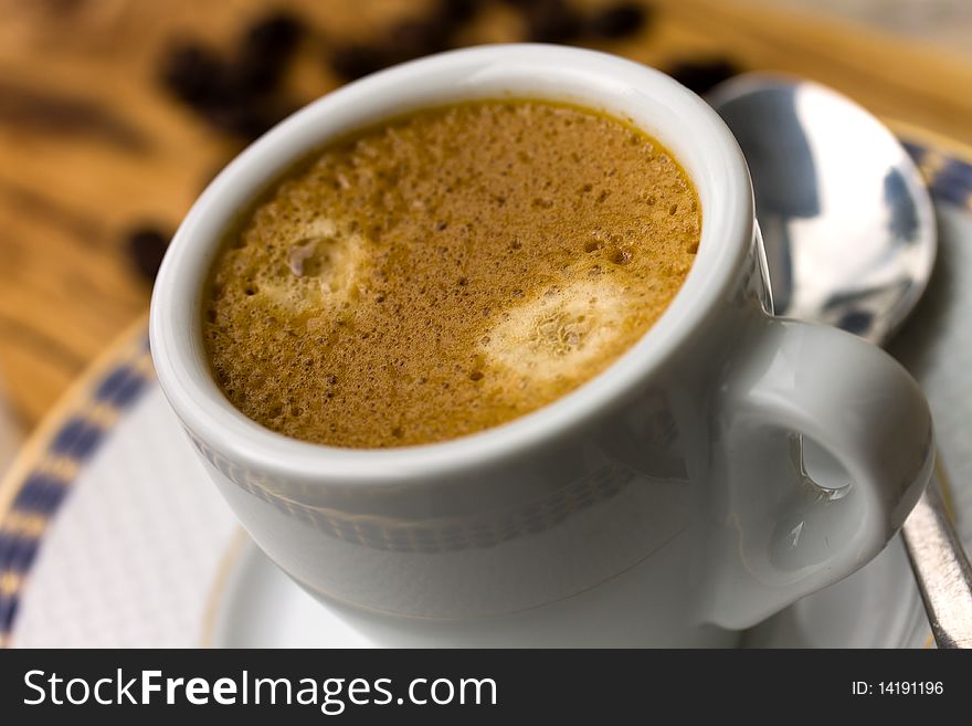 Cup Of Espresso With Coffee Beans