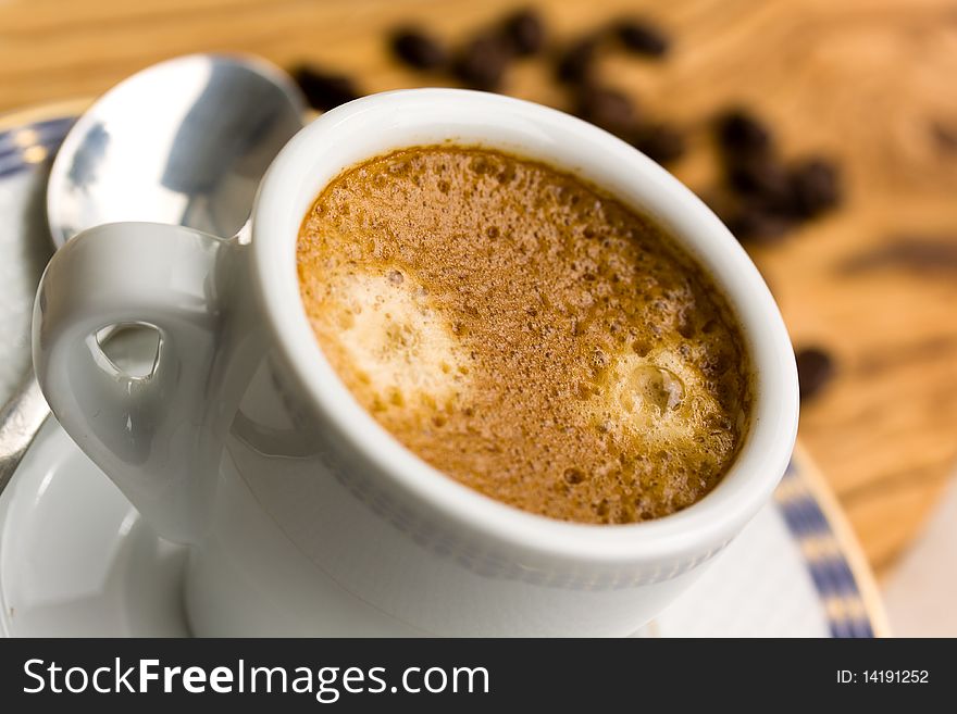 Cup of Espresso with Coffee Beans