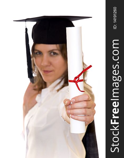 Young woman with graduation diploma and graduation hat isolated on white, diploma on a first scene, blurry women inn background. Young woman with graduation diploma and graduation hat isolated on white, diploma on a first scene, blurry women inn background