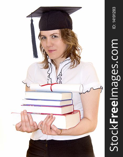 Young women with student hat and graduation diploma keeping several books, against a white background. Young women with student hat and graduation diploma keeping several books, against a white background