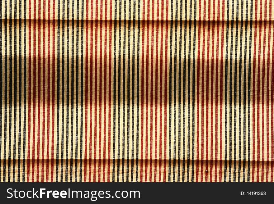 Closeup of colorful striped pattern on a picnic tablecloth. Closeup of colorful striped pattern on a picnic tablecloth.