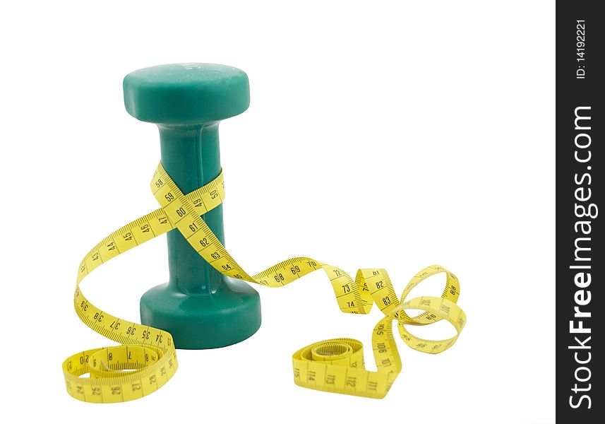Green dumbbell and yellow tape measure isolated on a white background. Green dumbbell and yellow tape measure isolated on a white background