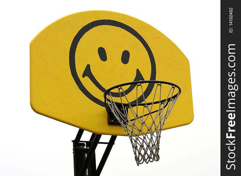 A yellow backboard with a smiley face. A yellow backboard with a smiley face.
