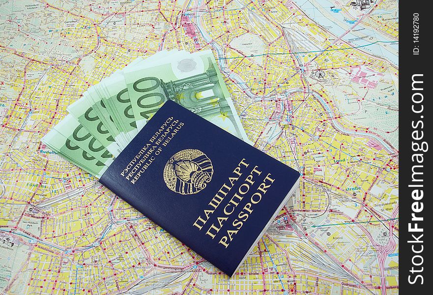Belarusian passport and one hundred euro banknotes over a map. Belarusian passport and one hundred euro banknotes over a map