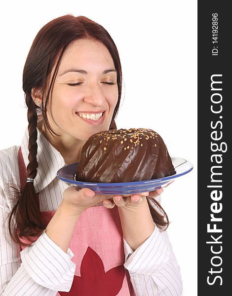 Beautiful housewife smelling bundt cake on white background. Beautiful housewife smelling bundt cake on white background