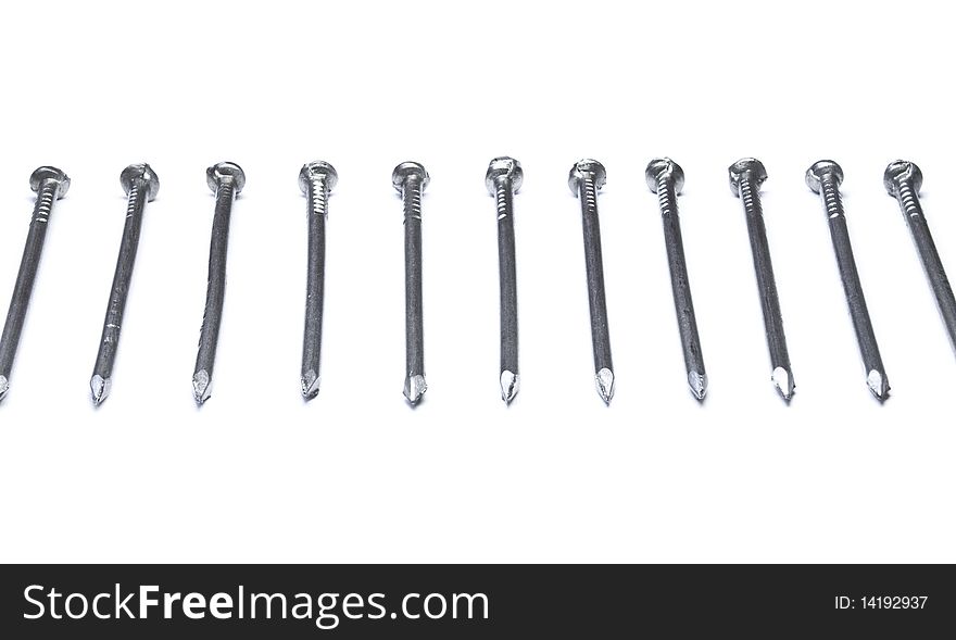 Row of nails isolated on white background