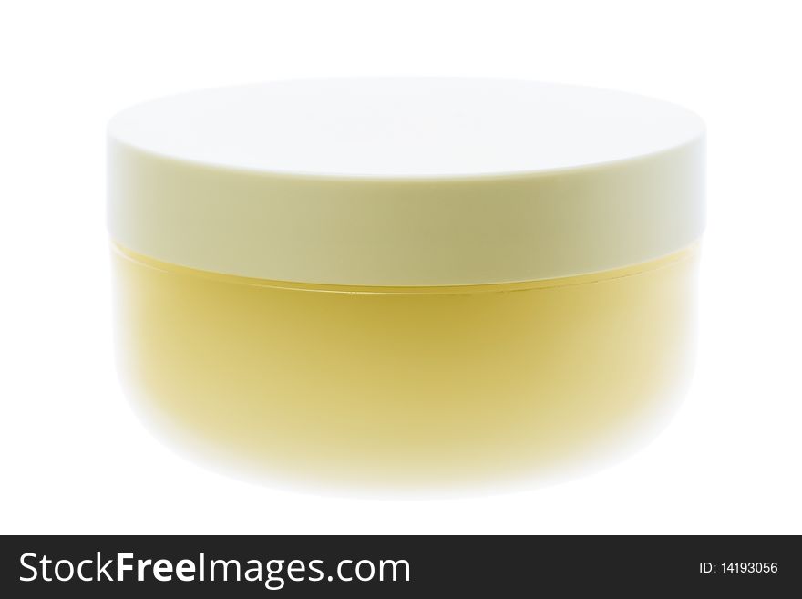 Close up of a closed cream jar isolated on white background