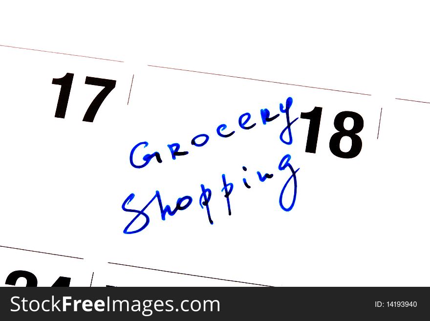 Reminder written down on a calendar about visiting of shop of Groceries. Reminder written down on a calendar about visiting of shop of Groceries.