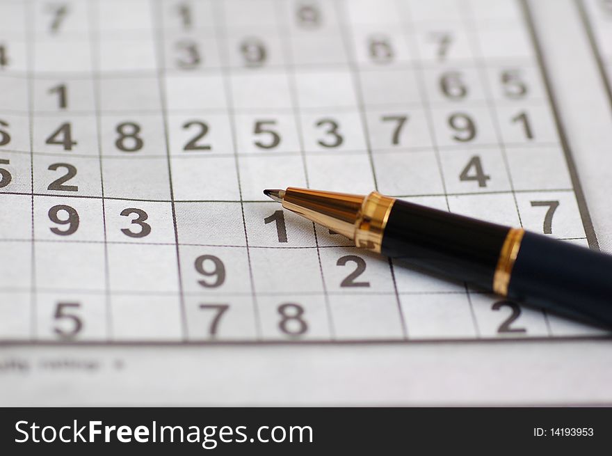 Macro shot of a ball pen and sudoku puzzle. Macro shot of a ball pen and sudoku puzzle.