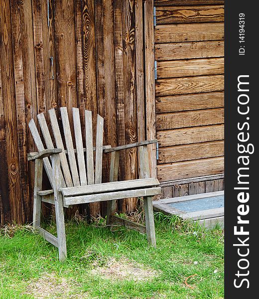 Old weatherworn garden chair in a fishing village on the iland of Gotland, Sweden. Old weatherworn garden chair in a fishing village on the iland of Gotland, Sweden.