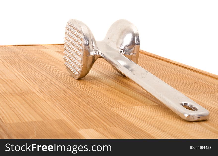 Series. aluminium meat tenderizer isolated on wooden background. Series. aluminium meat tenderizer isolated on wooden background.